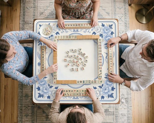 Square mahjong mat with a blue chinoiserie floral pattern on a light background.