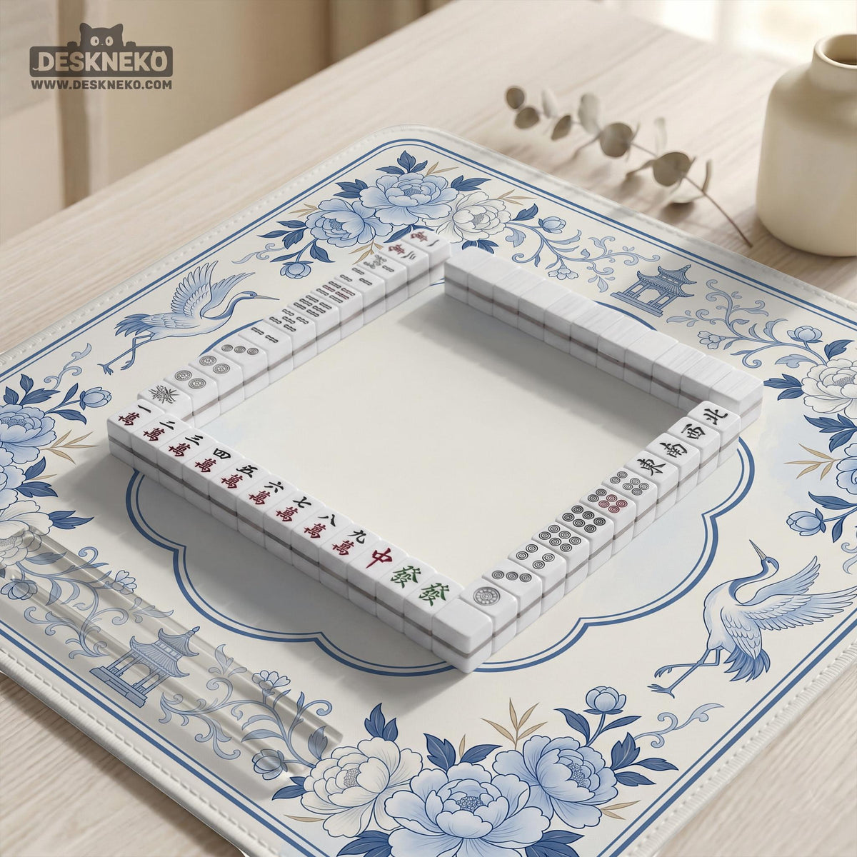 Square mahjong mat with a blue chinoiserie floral pattern on a light background.