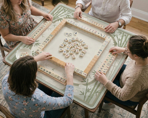 Square light green mahjong mat with bamboo stalks, soft ivory details, botanical shadows, mist lines, and a circular center design.