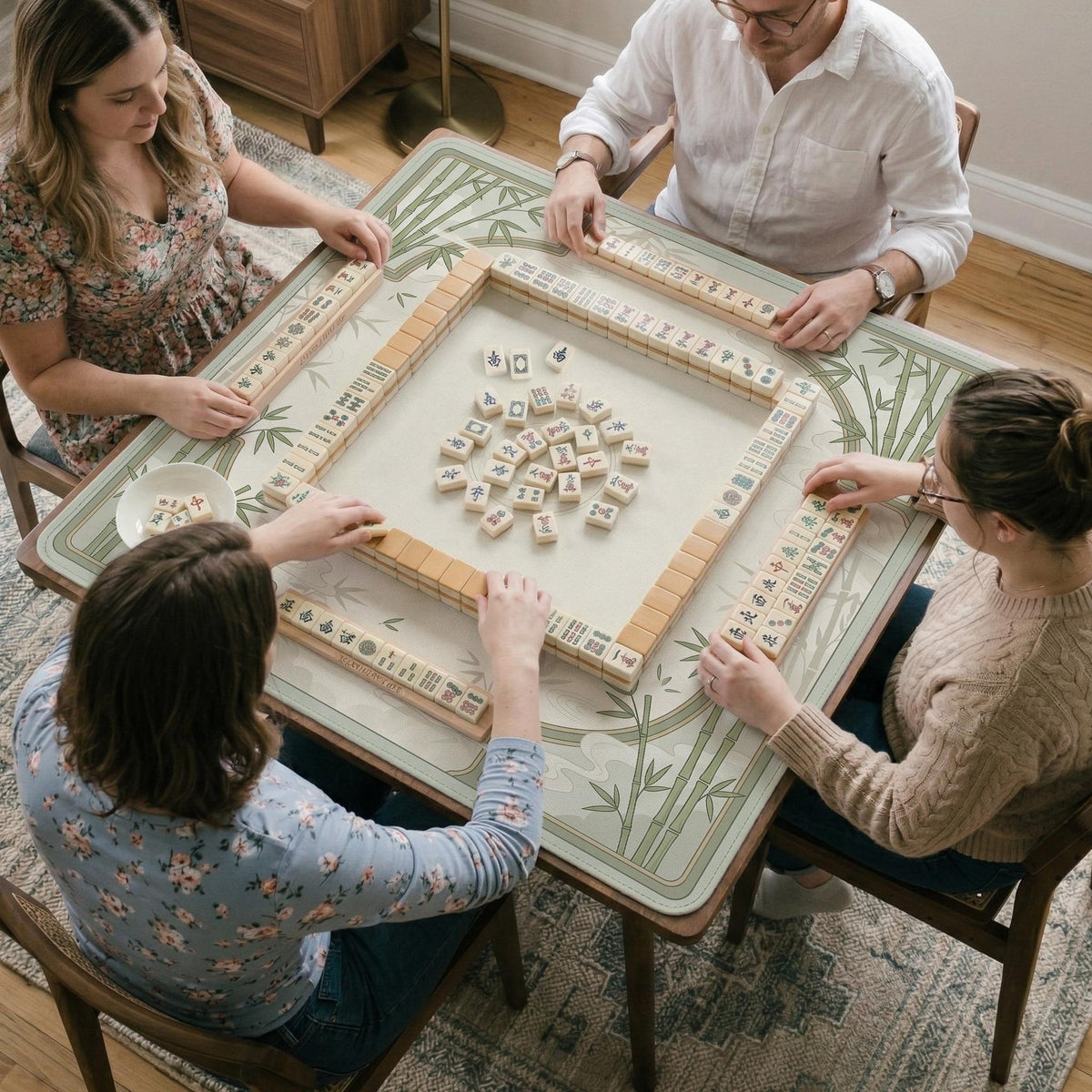 Square light green mahjong mat with bamboo stalks, soft ivory details, botanical shadows, mist lines, and a circular center design.