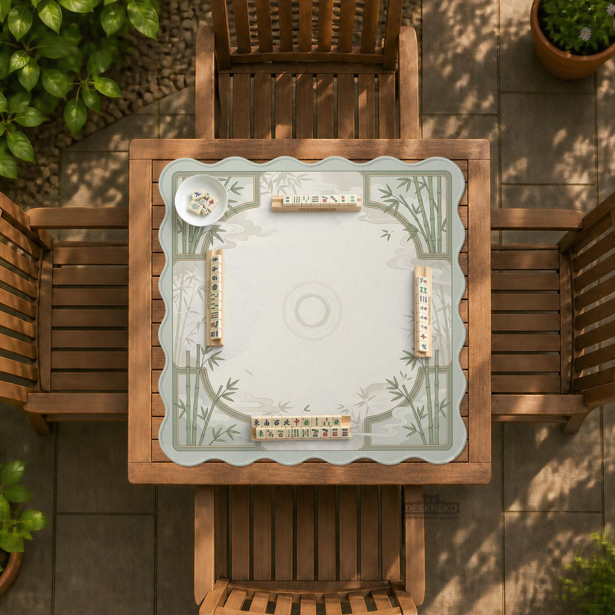 Square light green mahjong mat with bamboo stalks, soft ivory details, botanical shadows, mist lines, and a circular center design.