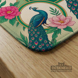 Green mahjong mat with peacocks, hibiscus flowers, tropical leaves, cream center space, and a scalloped floral border.
