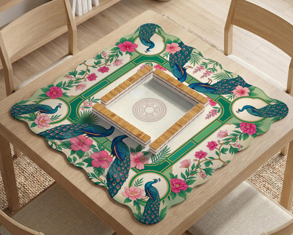 Green mahjong mat with peacocks, hibiscus flowers, tropical leaves, cream center space, and a scalloped floral border.