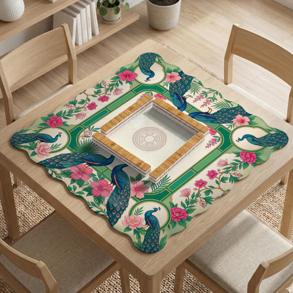 Green mahjong mat with peacocks, hibiscus flowers, tropical leaves, cream center space, and a scalloped floral border.