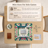 Green mahjong mat with peacocks, hibiscus flowers, tropical leaves, cream center space, and a scalloped floral border.