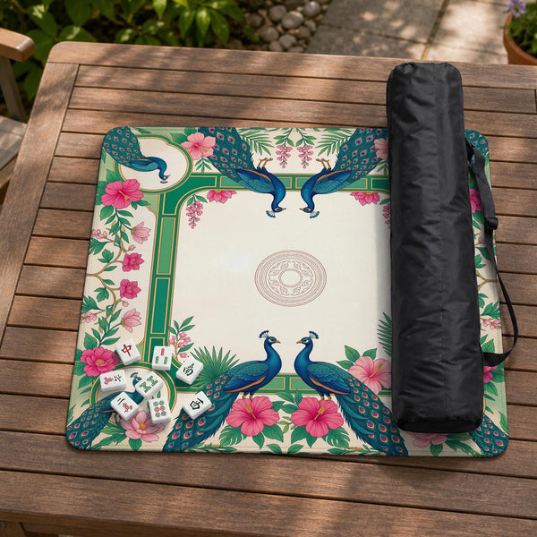 Green mahjong mat with peacocks, hibiscus flowers, tropical leaves, cream center space, and a scalloped floral border.