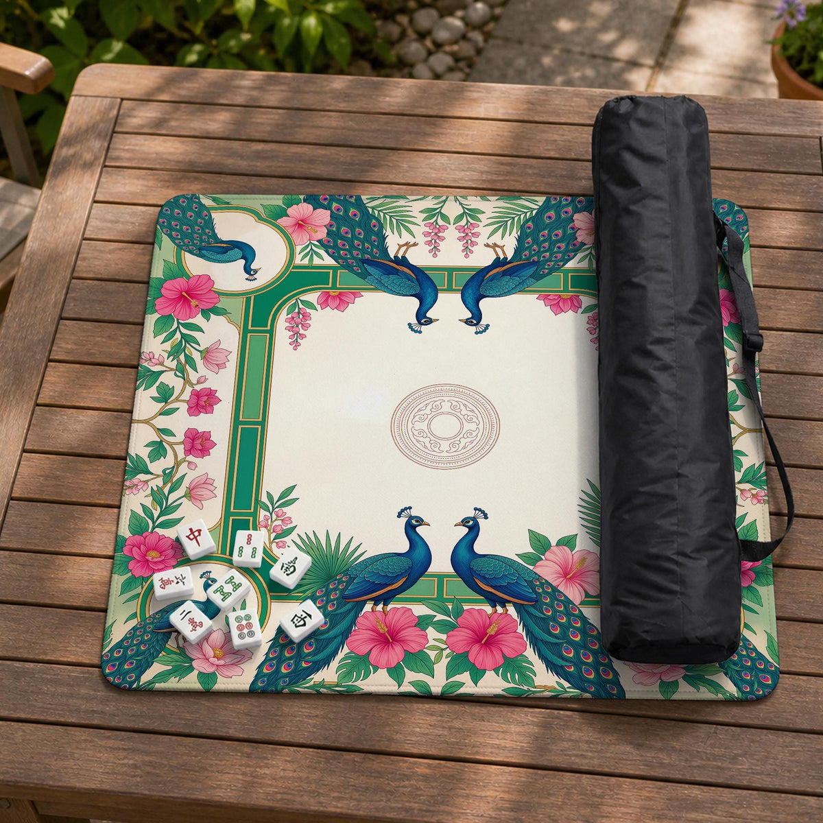 Green mahjong mat with peacocks, hibiscus flowers, tropical leaves, cream center space, and a scalloped floral border.