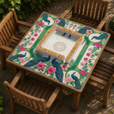 Green mahjong mat with peacocks, hibiscus flowers, tropical leaves, cream center space, and a scalloped floral border.