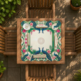Green mahjong mat with peacocks, hibiscus flowers, tropical leaves, cream center space, and a scalloped floral border.