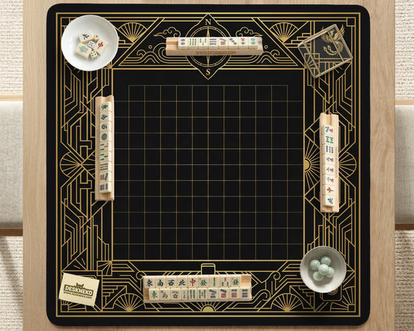Black and gold square mahjong mat with a scalloped edge, geometric border, thin line details, fan motifs, and dragon and phoenix accents around an open center.