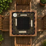 Black and gold square mahjong mat with a scalloped edge, geometric border, thin line details, fan motifs, and dragon and phoenix accents around an open center.