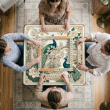 A green mahjong mat with peacock, floral, bamboo, pagoda, and gold border artwork in a scalloped chinoiserie style.