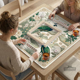 A green mahjong mat with peacock, floral, bamboo, pagoda, and gold border artwork in a scalloped chinoiserie style.