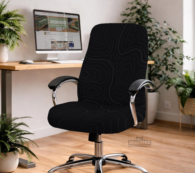 Black chair cover with a thin line art pattern on a gaming chair, shown with a high back and armrest areas covered.