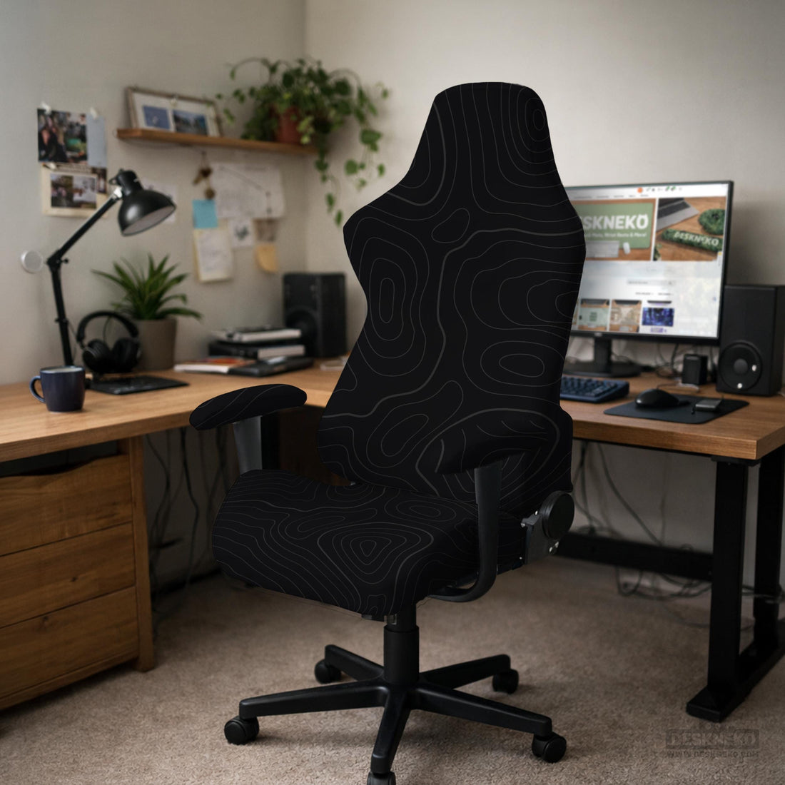 Black chair cover with a thin line art pattern on a gaming chair, shown with a high back and armrest areas covered.