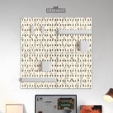 Cream pegboard wall organizer with small floral print, sage green stems, black slot layout, shelves, hooks, clips, and containers.