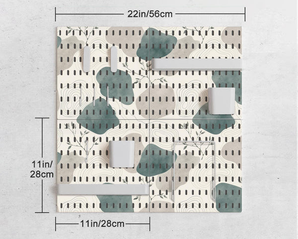 Four pegboard panels in sage green with cream, grey, teal, and leafy botanical artwork arranged in a square layout.
