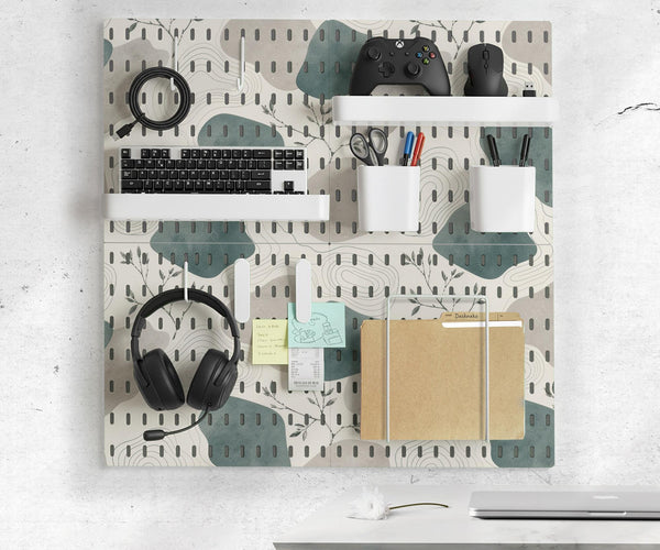 Four pegboard panels in sage green with cream, grey, teal, and leafy botanical artwork arranged in a square layout.
