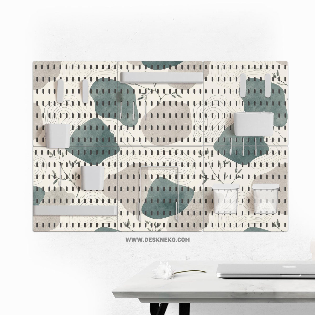 Four pegboard panels in sage green with cream, grey, teal, and leafy botanical artwork arranged in a square layout.