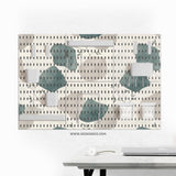 Four pegboard panels in sage green with cream, grey, teal, and leafy botanical artwork arranged in a square layout.