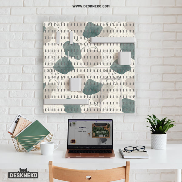Four pegboard panels in sage green with cream, grey, teal, and leafy botanical artwork arranged in a square layout.
