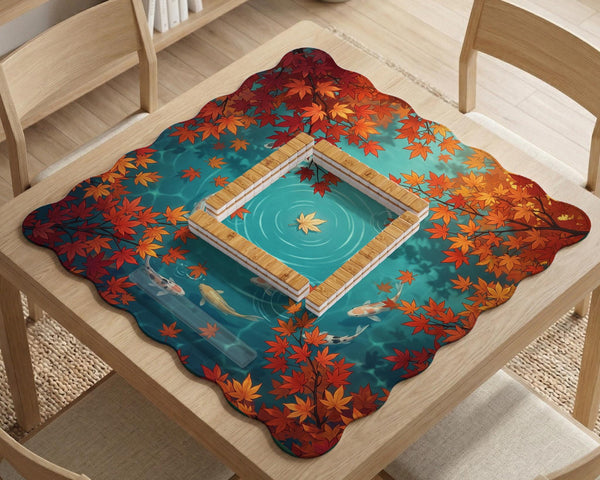 Square teal mahjong mat with koi fish, falling autumn leaves, and pond water artwork.