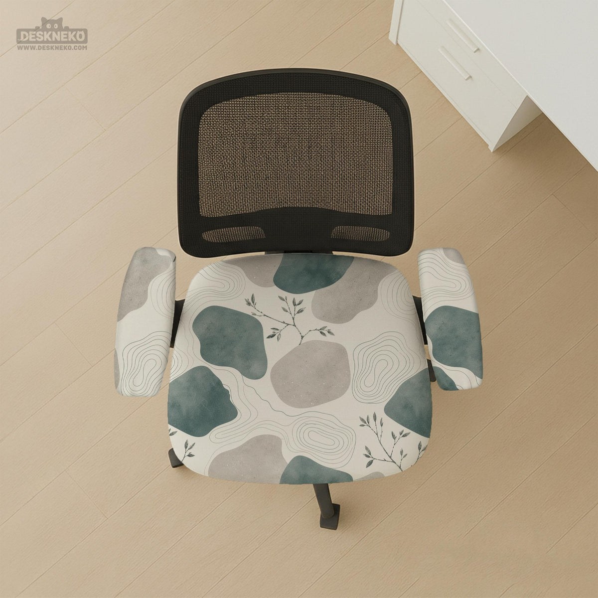 Chair cover with a cream background, muted sage abstract shapes, grey organic forms, and small botanical accents.