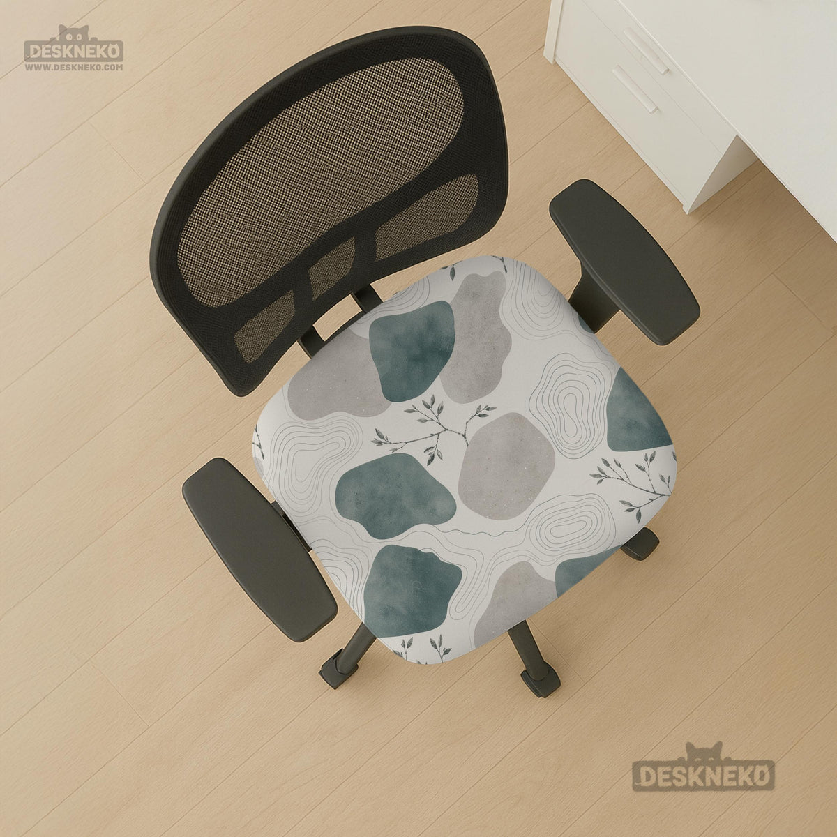 Chair cover with a cream background, muted sage abstract shapes, grey organic forms, and small botanical accents.