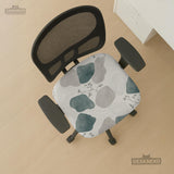 Chair cover with a cream background, muted sage abstract shapes, grey organic forms, and small botanical accents.