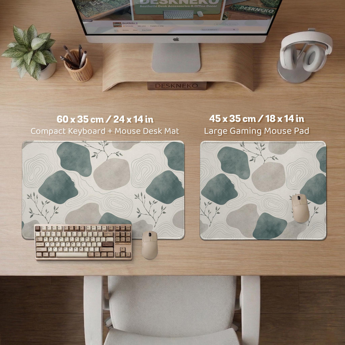 A desk mat with sage green abstract blocks, cream space, gray stone-like shapes, fine topographic contour lines, and small branch details.