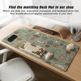 Sage green desk mat with a pattern of lounging cats, leafy plants, cactus pots, and earthy botanical details.