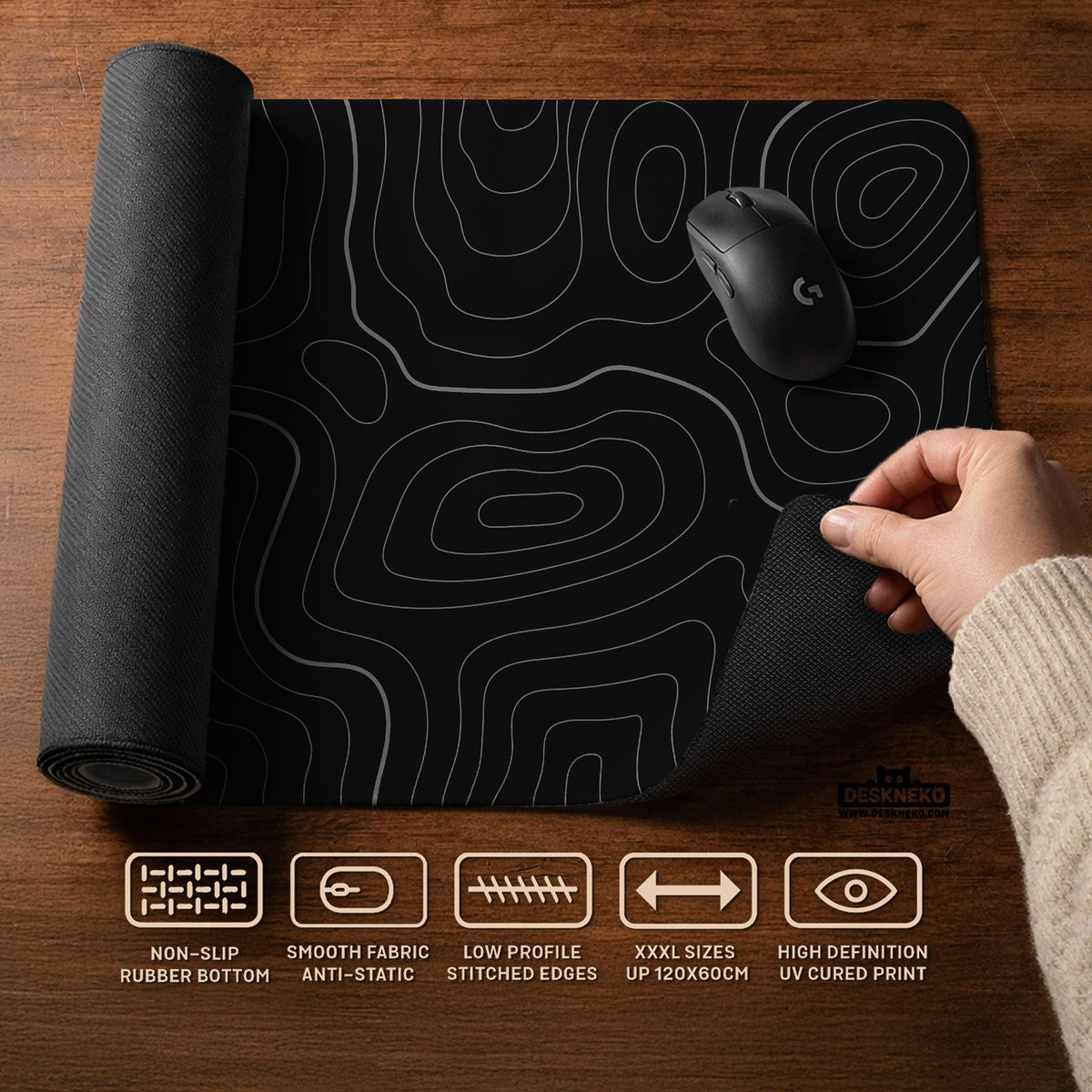Black desk mat with a thin gray topographic contour line pattern.