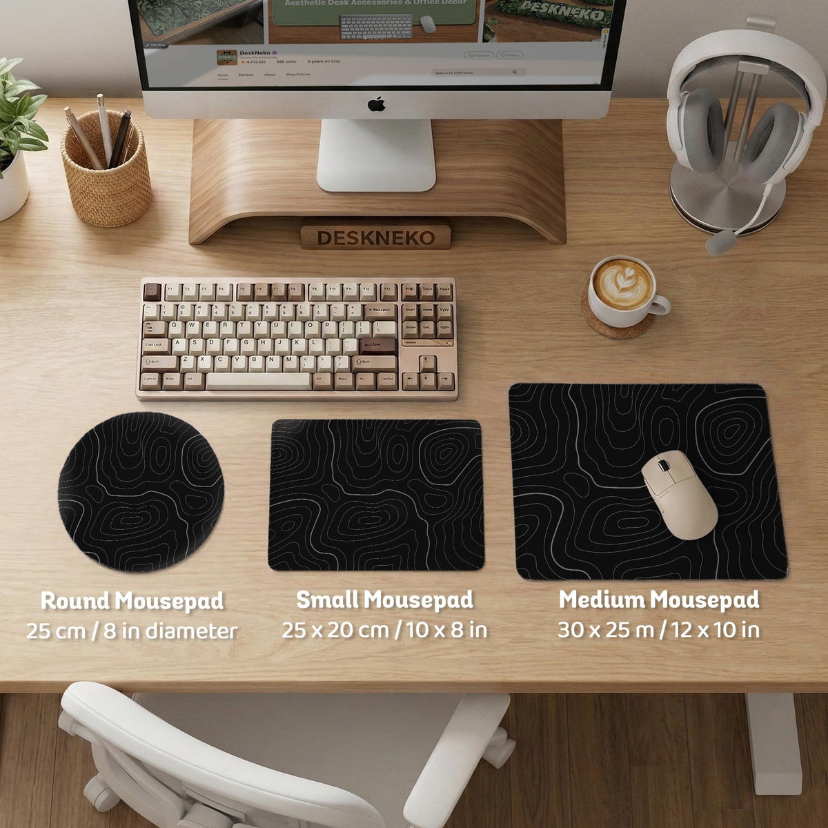 Black desk mat with a thin gray topographic contour line pattern.