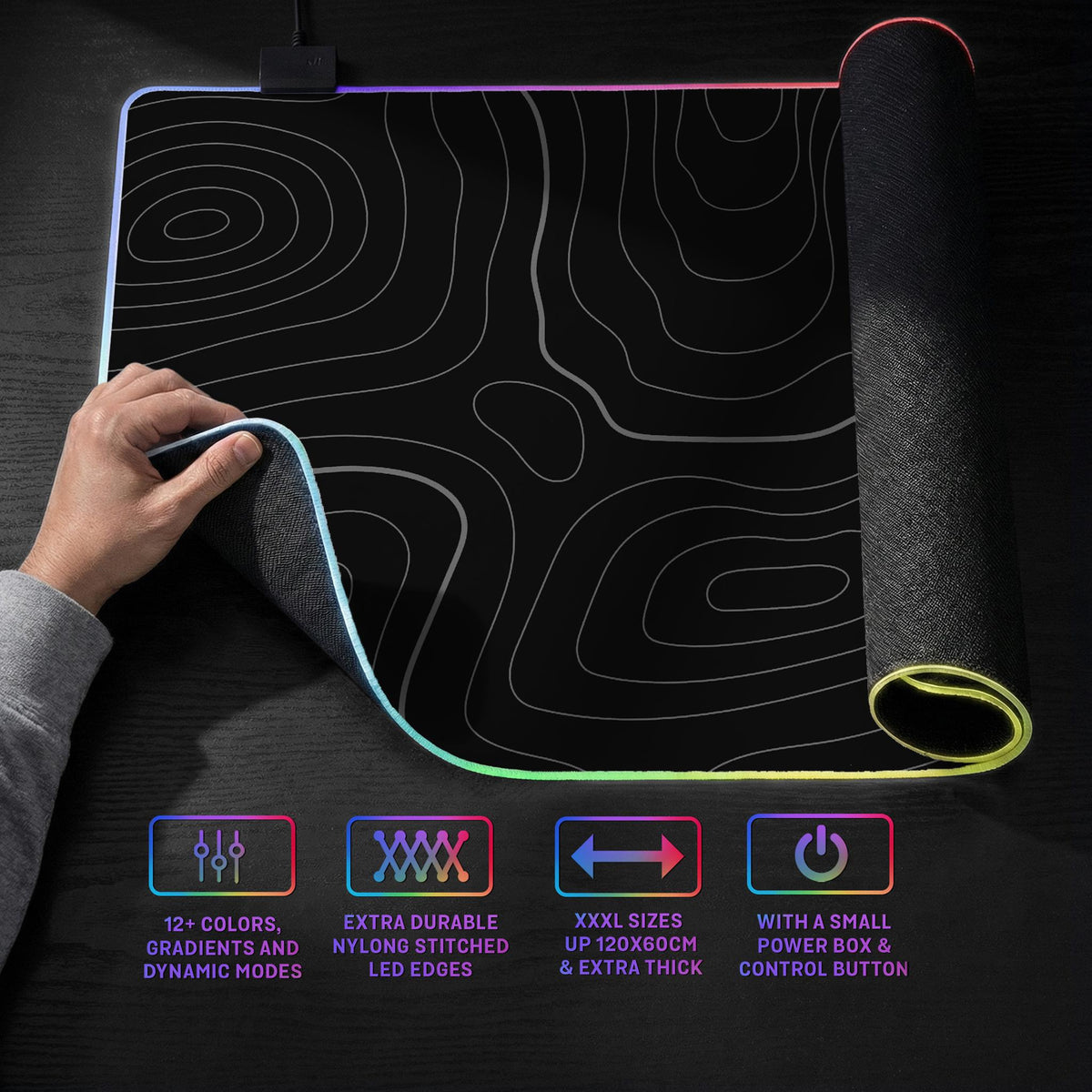 Black desk mat with a thin gray topographic contour line pattern.