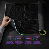 Black desk mat with a thin gray topographic contour line pattern.