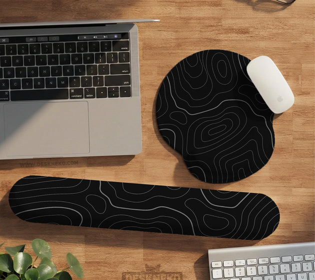 Black mousepad with a gray topographic contour line pattern shown with matching keyboard wrist rest options.