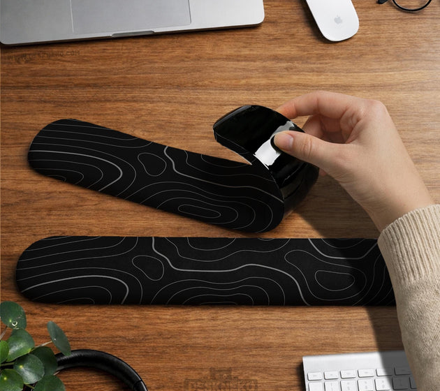 Black mousepad with a gray topographic contour line pattern shown with matching keyboard wrist rest options.