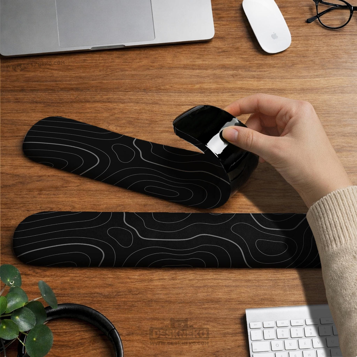 Black mousepad with a gray topographic contour line pattern shown with matching keyboard wrist rest options.