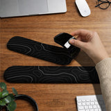Black mousepad with a gray topographic contour line pattern shown with matching keyboard wrist rest options.