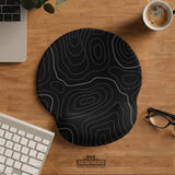 Black mousepad with a gray topographic contour line pattern shown with matching keyboard wrist rest options.