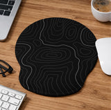 Black mousepad with a gray topographic contour line pattern shown with matching keyboard wrist rest options.