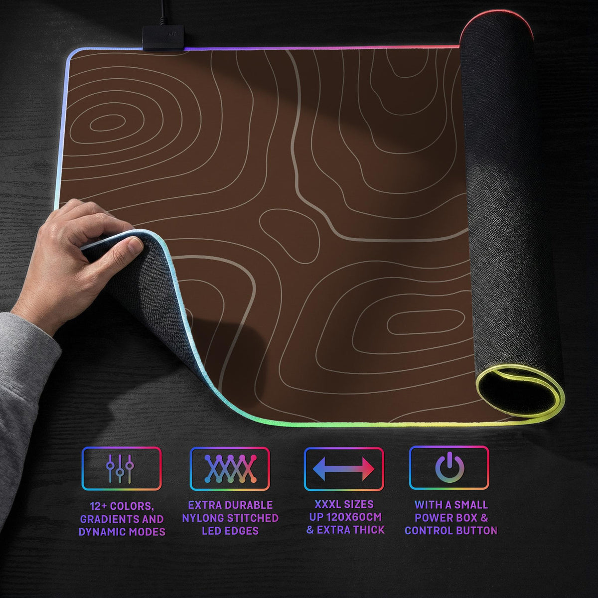 Brown desk mat with a repeating topographic contour line pattern in a neutral earth tone design.