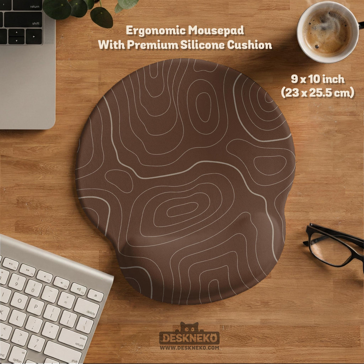 Brown desk mat with a repeating topographic contour line pattern in a neutral earth tone design.