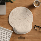 Beige mousepad and keyboard wrist rest with a topographic line pattern shown in a neutral desk setup.