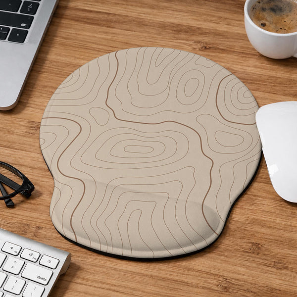 Beige mousepad and keyboard wrist rest with a topographic line pattern shown in a neutral desk setup.