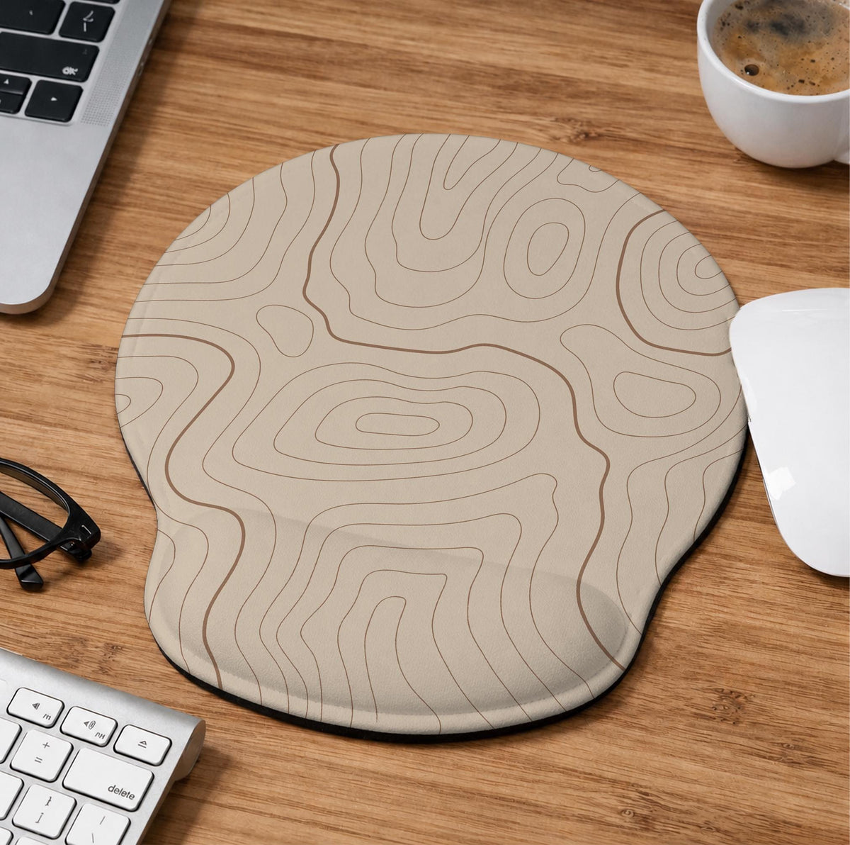 Beige mousepad and keyboard wrist rest with a topographic line pattern shown in a neutral desk setup.