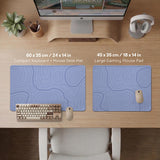 A pastel blue mousepad with an abstract topographic contour line pattern.