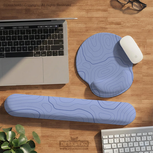 Periwinkle ergonomic mousepad and keyboard wrist rest with a light blue topographic contour line pattern.