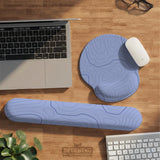 Periwinkle ergonomic mousepad and keyboard wrist rest with a light blue topographic contour line pattern.