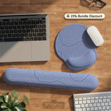 Periwinkle ergonomic mousepad and keyboard wrist rest with a light blue topographic contour line pattern.